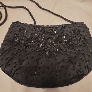 Black beaded purse with corded shoulder strap